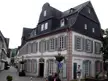 Eberhard house in the Pfaffengasse, a historic building with a dark mansard roof and white shutters in Rhineland-Palatinate