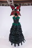 Anime girl in a black gothic dress with green roses and a red and black butterfly mask