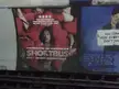 Shortbus movie posters on an indoor wall at King's Cross with a group of people