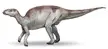 Probactrosaurus dinosaur concept art with grey and brown spotted skin and a long tail on a white background