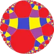 Rhombitetraapeirogonal tiling featuring a colorful geometric pattern of interlocking shapes in a circular frame.