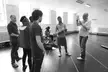 A group of friends in streetwear, denim jeans, and Converse gathered in a studio for The Loneliness of the Long Distance
