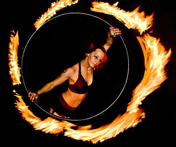 Hooper performing with a fire hula hoop in New York City