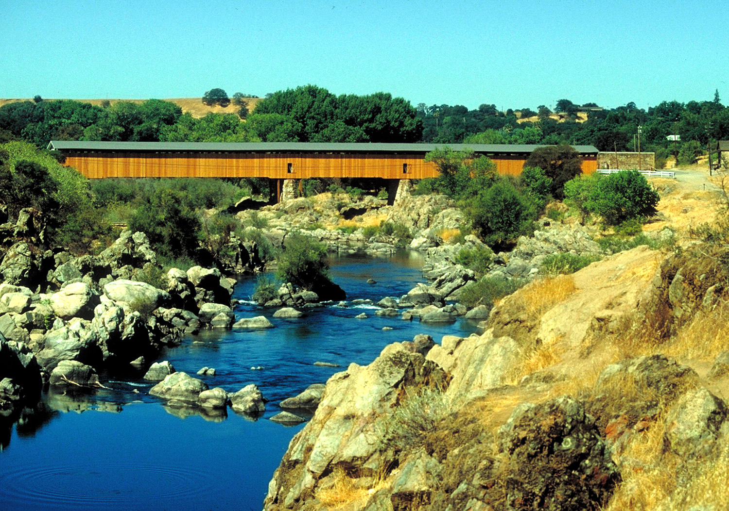 Low water on the Stanislaus River at Knights Ferry Covered Bridge