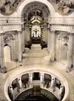 Les Invalides interior featuring Napoleon's sarcophagus under a golden canopy with neoclassical statues and columns