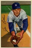 Joe Collins in a white pinstriped jersey and blue baseball cap catching a ball with a glove