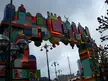 Advent calendar archway with numbered doors under a cloudy sky, vintage christmas photos style