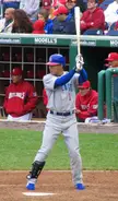 Fukudome at bat for the Chicago Cubs, wearing a baseball cap and athletic wear on a baseball field.