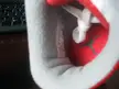 Close-up of a red and white sneaker insole featuring a Jumpman logo and size tag