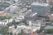 Aerial view of the Cologne University Hospital campus in Lindenthal featuring a glass skyscraper and urban architecture