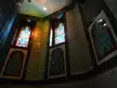 The Bathhouse interior featuring ornate decorative wall panels and stained glass windows.