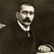 Gustav Noske in a black and white gravure portrait wearing a dark suit, white shirt, and tie.