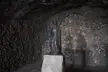 Statue of the Virgin of Candelaria on a stone pedestal inside the rocky cave of Achbinico