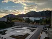 Dahei Mountain and the modern campus plaza of Dalian University under a sunset sky
