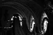 H.R. Giger style interior with organic ribbed arches and sculpted seating in black and white