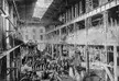Dry Dock Complex in Detroit, Michigan, featuring workers and industrial machinery in a black and white gravure