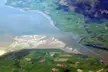 Aerial view of the River Nith estuary opening into the Solway Firth with sandbanks and green fields.
