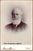 John Richardson Wigham in a vintage sepia-toned studio portrait with a white beard and dark suit