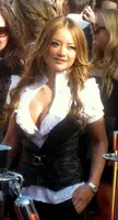 Tequila at the 2008 MTV Video Music Awards wearing a white ruffled blouse, black leather vest, and black skirt