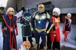 Guardians of the Galaxy group in colorful costumes including a red dress and a corgi dog outdoors