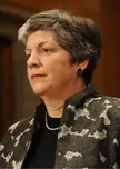 Governor of Arizona with short grey hair, pearl necklace, and floral print jacket