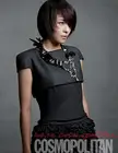 Ha Ji Won wearing a dark grey short-sleeved dress with a ruffled skirt and a chunky statement necklace