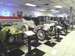 Vintage cars at the Martin Auto Museum on a black and white checkered floor