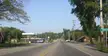 A rural roadside view in Keshena, Wisconsin, featuring a gas station and buildings under the Underhill sign.