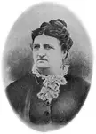 Josefa Carrillo Fitch in a black and white vintage photo wearing a dark dress with a white ruffled collar