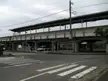 Nobukata Station in Itako Ibaraki featuring an elevated train station platform, a white car, and a crosswalk.