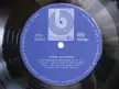 Close-up of a vintage Balkanton record label from a state-owned record label, featuring blue and white text.