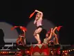 Madonna and blonde girls in red and white striped costumes and headbands performing Hanky Panky on stage