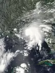Satellite view of a large white cloud formation over a coastal region and the ocean during the 2018 Atlantic hurricane season