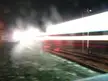 Aesthetic 4k desktop wallpaper of a high-speed train creating white and red light streaks on railroad tracks at night