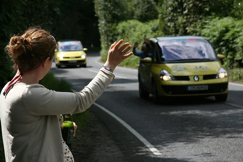 Rachel Waves at a passing car
