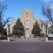 Boulder County Courthouse Art Deco building with Christmas wreaths in a public plaza with a group of people