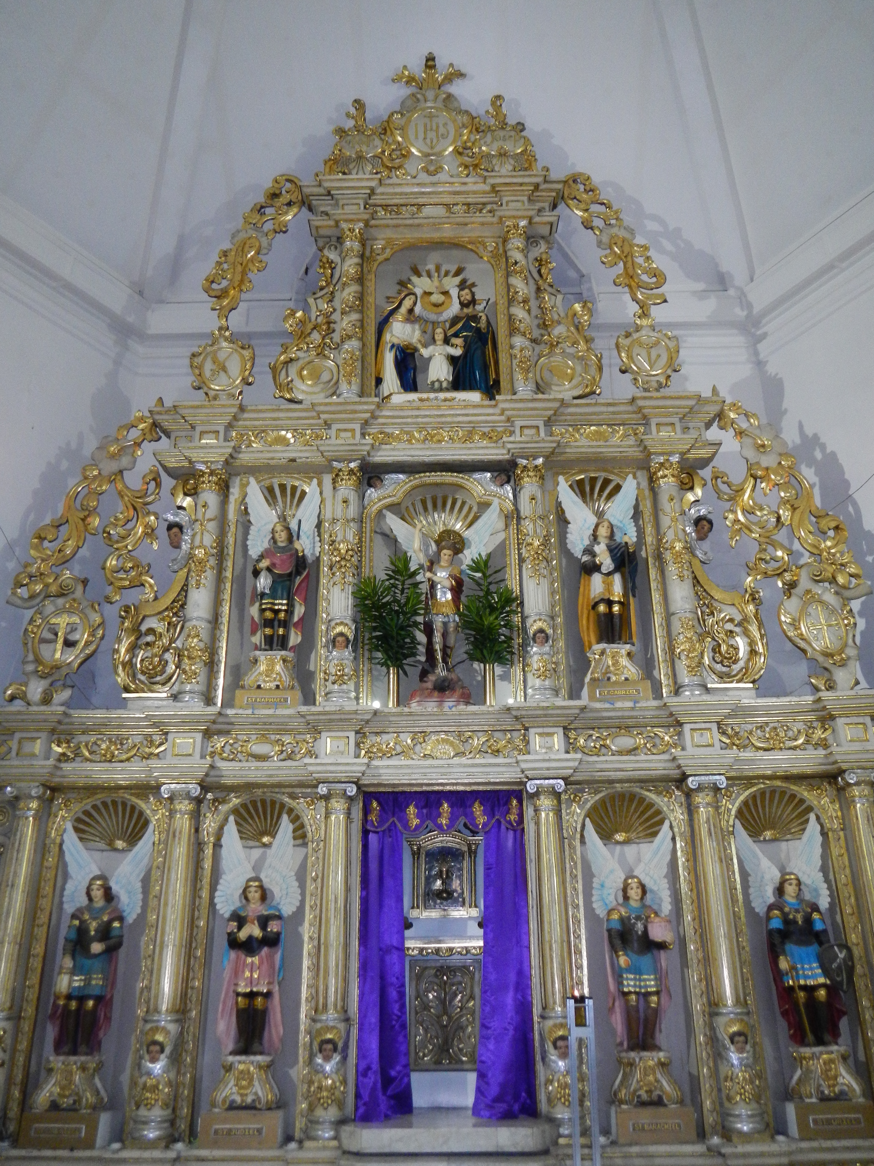 18th century altarpiece featuring the seven archangels and a tableau of the Holy Family