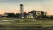 Melkonian Educational Institute vintage gravure showing a headframe tower and industrial buildings in a grassy field