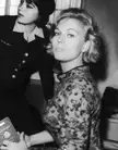 Novak in Madrid, 1962, a black and white close-up of two beautiful women, one in a floral dress holding a passport