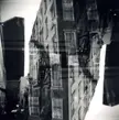 Black and white gravure of urban buildings with overlapping windows and fire escapes in a double-exposure style.