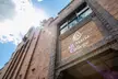 The Rose Pelletier building at Mt Maria College, a brick building under a sunny sky.
