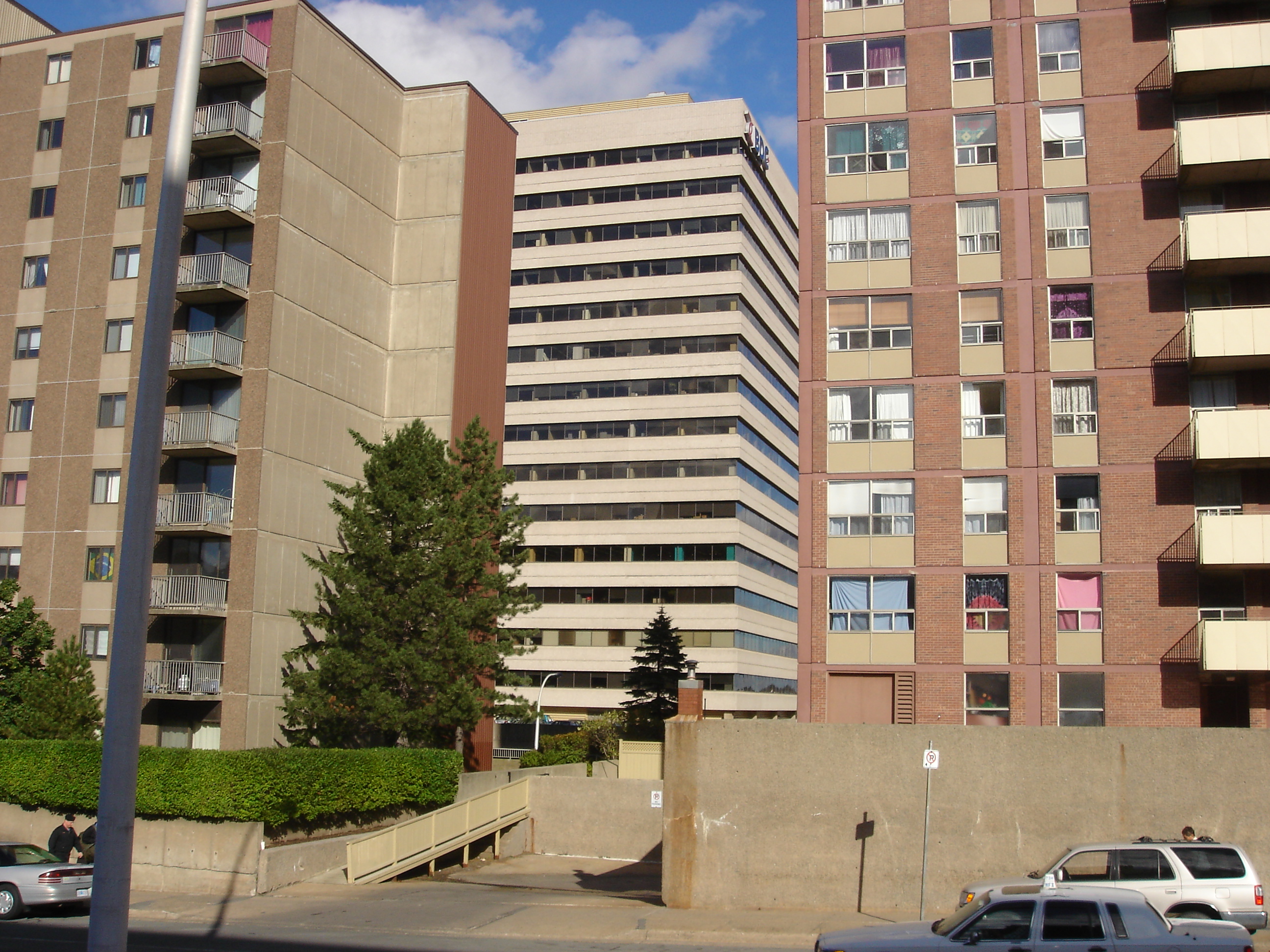 Cogswell Tower between two apartment buildings