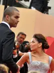 Parker and Longoria at the 2009 Cannes Film Festival, featuring a silver sequined dress and black suit