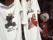 Berlin streetwear white t-shirts and a stuffed teddy bear with a red ribbon