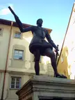 Bronze statue of a man in historical costume in Regensburg, near a displaced persons camp site.