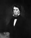 James T. Archer in a fine art reproduction oil painting, wearing a dark suit and bow tie.