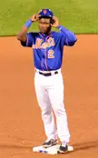 Herrera in a blue Mets jersey and helmet standing on a baseball base