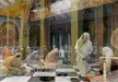 Group of beautiful women in traditional Indian costume and white dresses seated on a marble floor at Krishna Valley Hungary