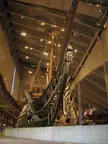 The Vasa ship, an ancient wooden vessel, displayed inside the concrete Vasa Museet museum.