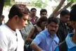 A group of friends including an Indian woman in a pink and grey top standing outdoors in Pune